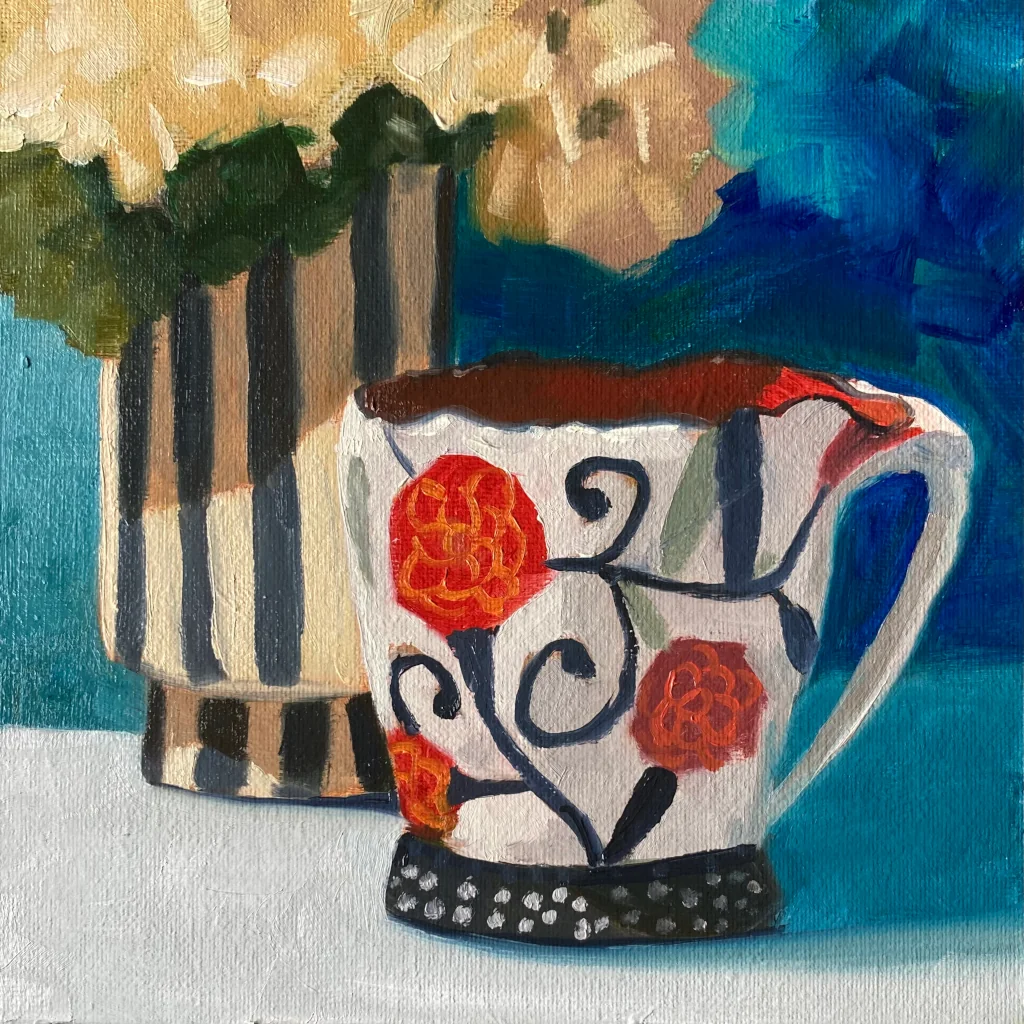 Oil painting of a mug with a floral design and a striped vase with cream flowers.